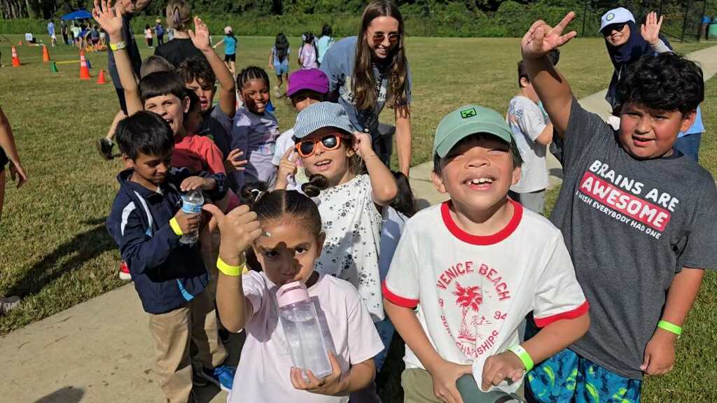 A group of excited students enjoying field day.