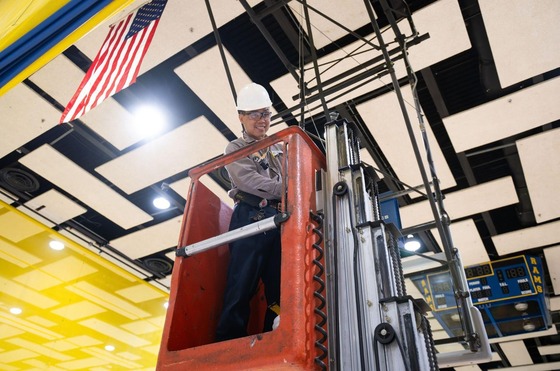 Structural Trades Technician Khoi Nguyen inspects the ceiling
