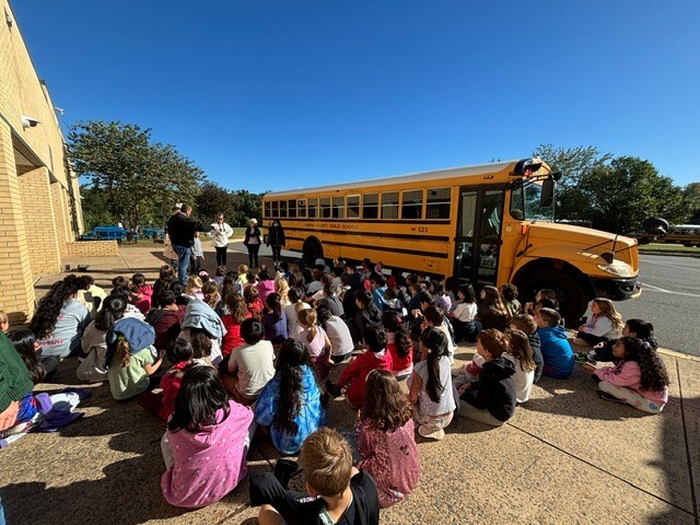 Third graders reviewing bus safety.