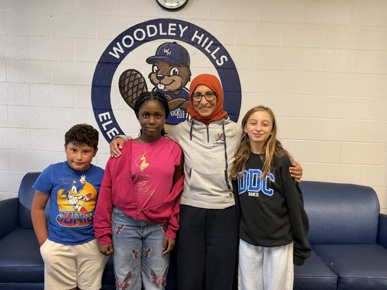 Dr. Khalid-Schieber and students gather in the lobby