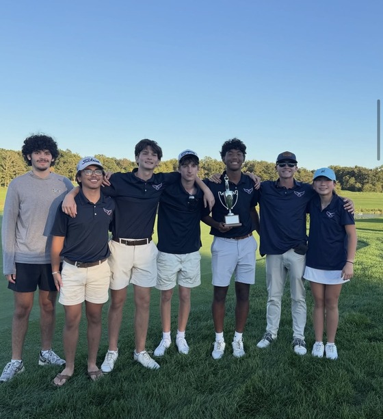 Students standing on the golf course