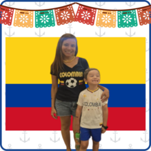 Columbian Flag in the background with image of Mrs. Fajardo and her son wearing colombia jerseys smiling for the picture