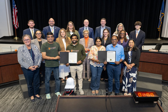 Asha-Jyothi representatives receive School Board proclamation recognizing their support for FCPS.