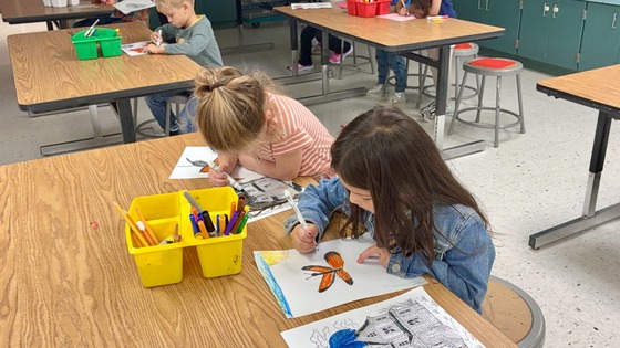 Students drawing butterflies