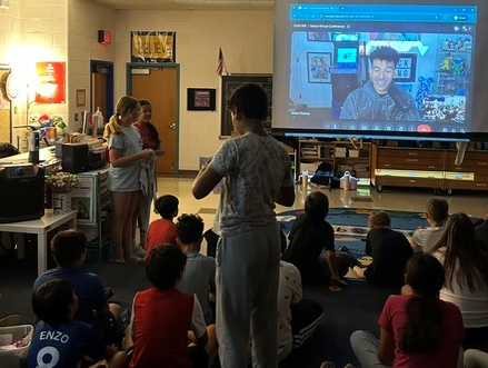 student group asking questions to Khleo Thomas