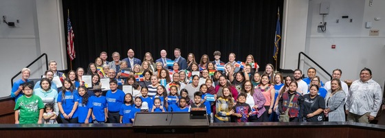 Group gathered at dais to celebrate Hispanic Heritage Month