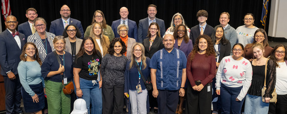 School Board Members and community at the dais celebrating the LGBTQIA+ History Month Proclamation.