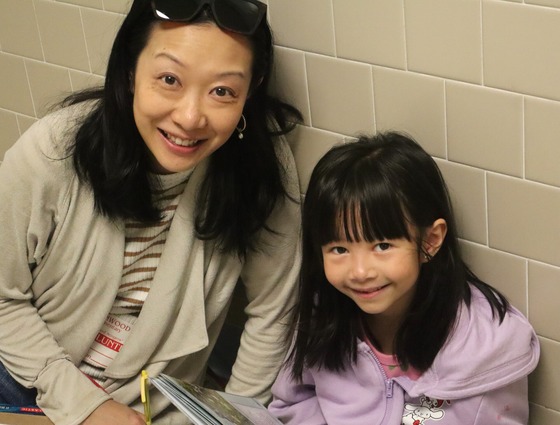 A student and her mother participating in the 2nd grade family invite