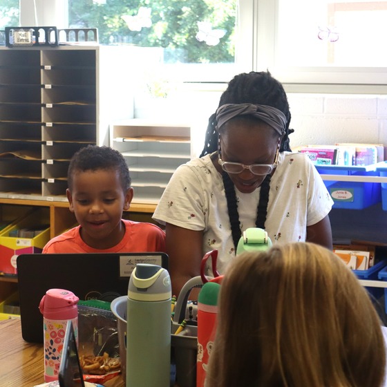 A student and his mother participating in the 2nd grade family invite