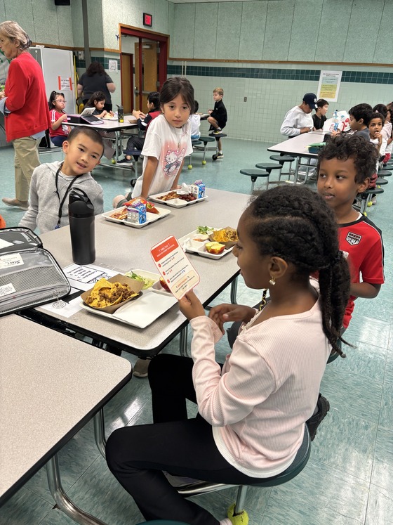 Students using conversation cards at lunch