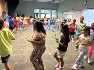 students in music class making beats