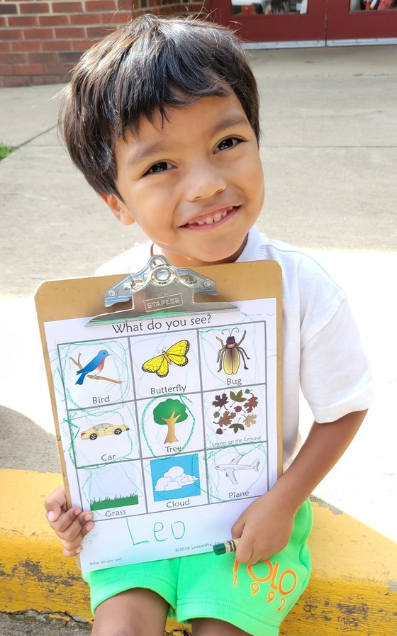 student completing an outdoor exploration worksheet