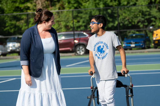 Irving student walks with Ms. Tillman