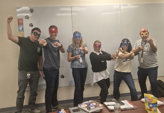 picture of adults dressed as superheroes
