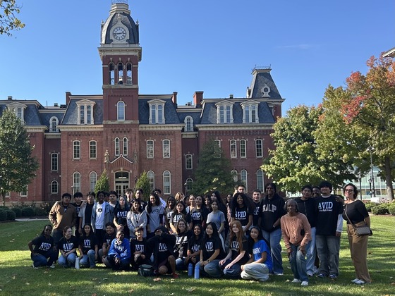 students and teachers at a university posing for a picture