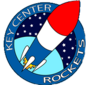 Circular logo for Key Center Rockets featuring a red, white, and blue rocket blasting off past Earth into space. 