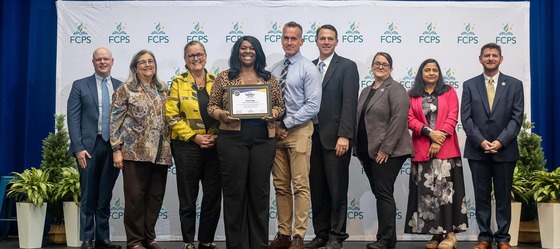 School Board members with Dr. Reid and Impact Award winners
