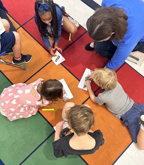 picture of kids learning on the carpet