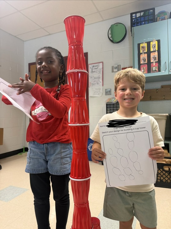 Kindergartners with their cup tower design and work