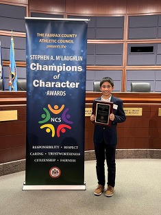 photo of Kanan Bae receiving the Champions of Character Award