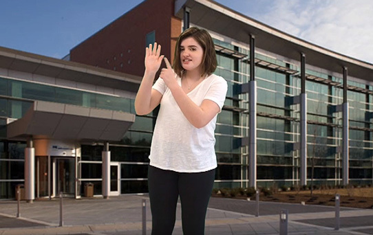 Sarah Jagel standing in front of Kelly Leadership Center