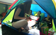 LitCamp students reading in a tent