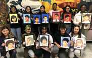 Hylton art students display their portraits of refugee children.