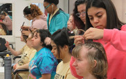 Stonewall Jackson cosmetology students style the hair of students participating in the Unified Sports program