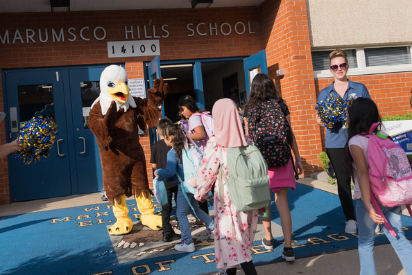 Eagle mascot greeting students at Marumsco Hills Elementary