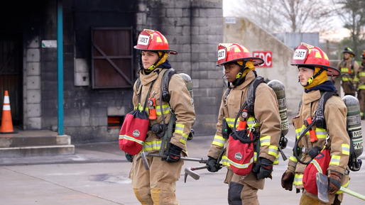 Three students in firefighter gear