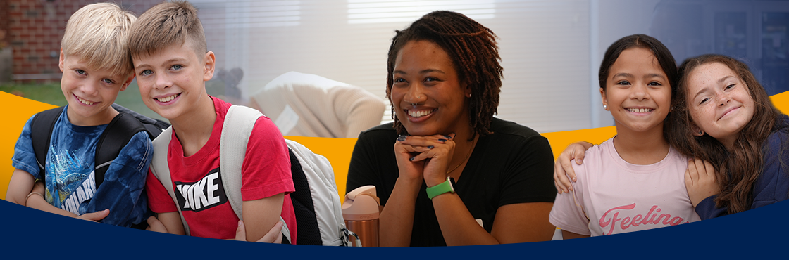 two smiling students on either side of a new teacher