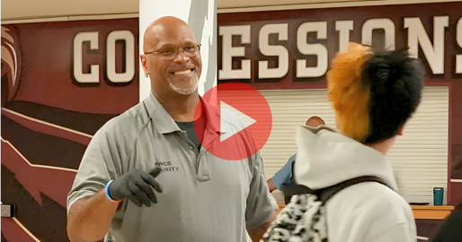 security officer smiling at a student