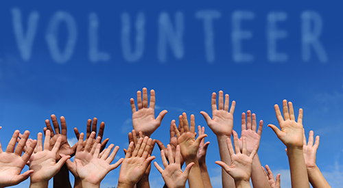 Volunteer with raised hands