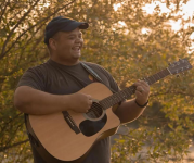 Image of Philip Bowen with his guitar