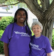 two women volunteers smiling 