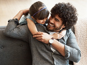 father and daughter smiling 