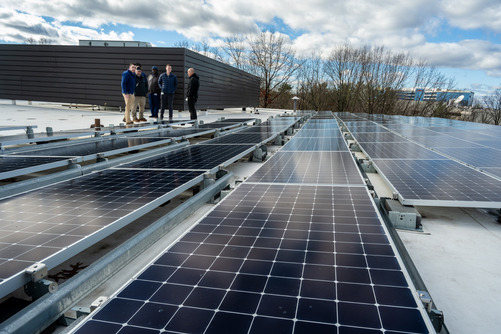 solar panels on roof with fairfax county staff to the left