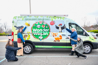 wonder wagon staff posing in front of the truck