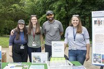 Emily and Allison from OEEC with Jodie from Family Services and Ryan from Dominion Energy at an outreach table