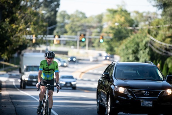 bicylist sharing road with cars in fairfax county