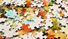 Image of a pile of multicolored puzzle pieces