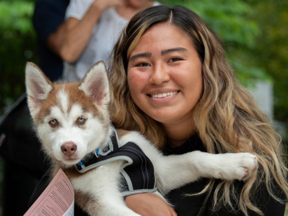 Community member and a puppy.