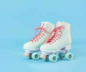 Image of light blue roller skates with pink laces