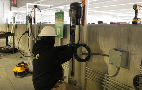 man installing EV charger