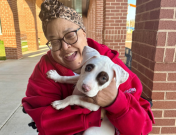 Lady at Vaccine and Microchip Clinic with a puppy