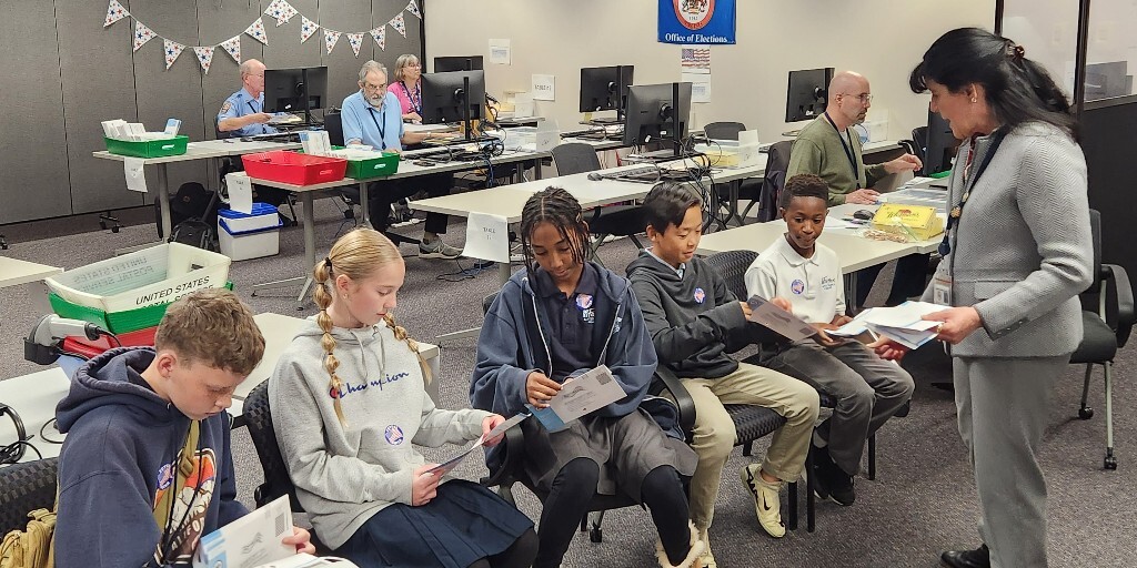 Students in 6th grade observing voting process