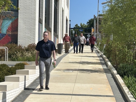 pedestrians walking the tysons community circuit