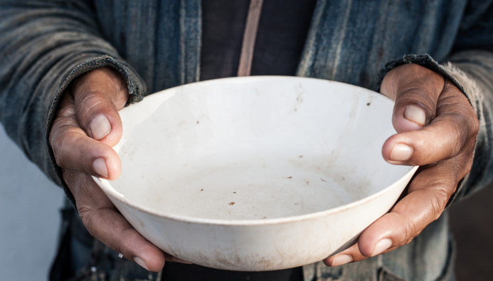 Image of a person's hands holding an empty bowl.