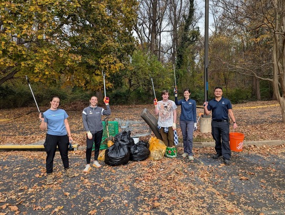 a clean up crew posing for a photo with their litter collection