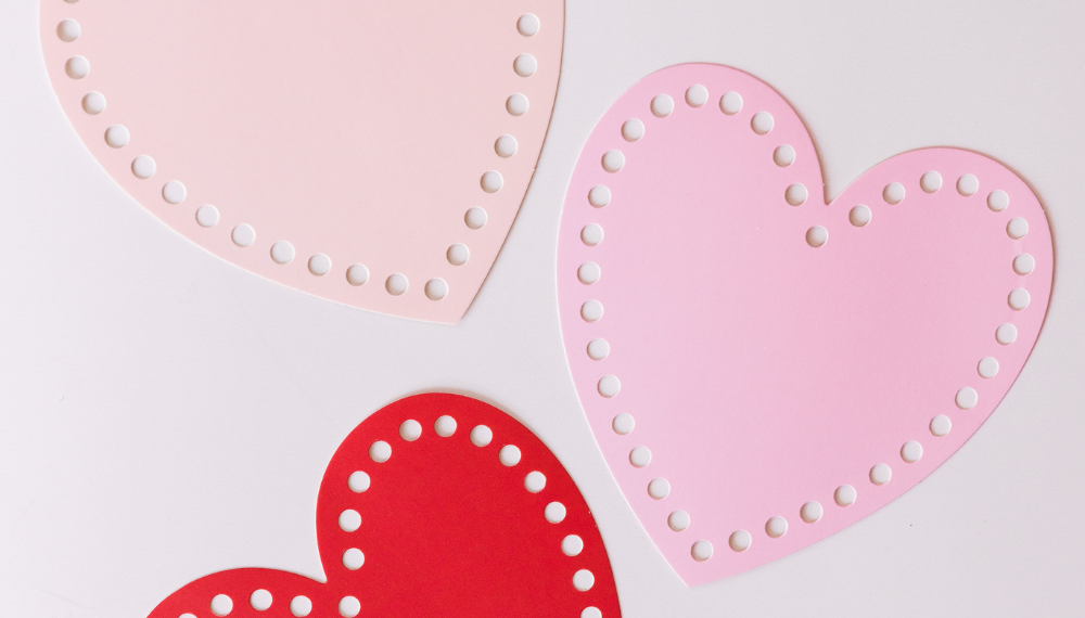 Image of multicolored paper hearts. 